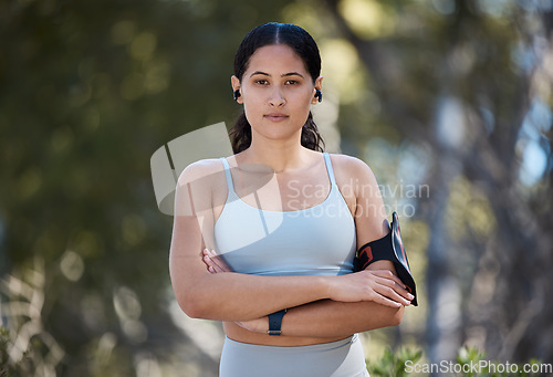 Image of Fitness, portrait and woman with arms crossed ready for fitness workout or exercise in nature outside. Park, health and wellness with a female ready for athletic physical and sporty training