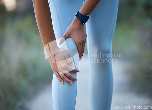 Image of Knee pain, injury and sports accident of a woman hiking, running or doing exercise in nature. Medical emergency, muscle sprain and injured leg of an athlete outdoor trekking for a workout or training