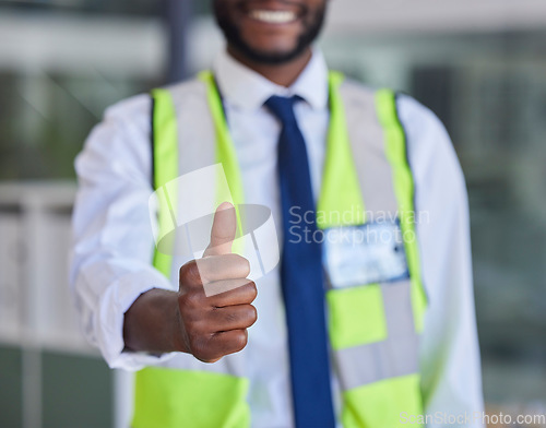 Image of Black man, construction worker or thumbs up success, support and trust in office building, construction site or industrial warehouse. Zoom, smile or happy builder, property designer or engineer hand