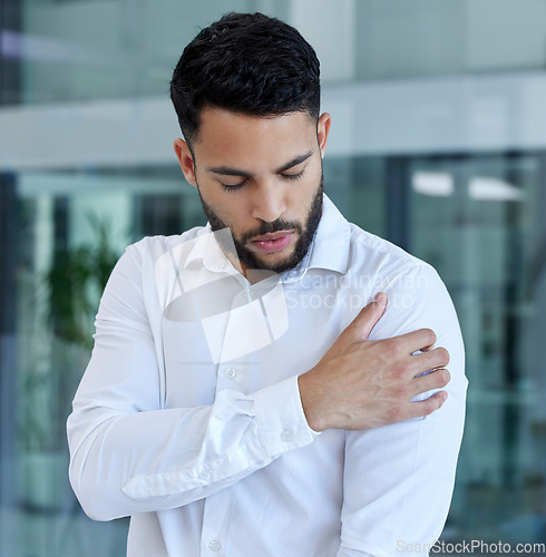 Image of Shoulder pain, injury or accident of a businessman in the office with stress, frustrated and burnout. Medical emergency, muscle sprain or injured arm of a professional male employee at the workplace.