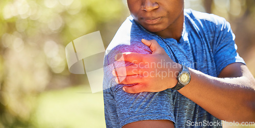 Image of Hand, shoulder and pain with a sports black man holding his joint after injury during his fitness or exercise. Health, medical and anatomy with a male athlete suffering damage highlighted by CGI