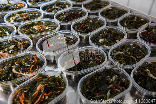 Image of Different fish and chuka wakame laminaria seaweed salad