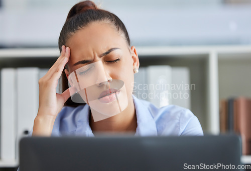 Image of Headache, stress and burnout of business woman at computer with pain, stress and depression while tired and frustrated with work. Female entrepreneur at desk with anxiety and mental health problem