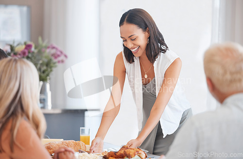 Image of Happy woman hosting food at dinner table in home, house and dining room for family lunch, meal and social gathering together. Party, celebration and eating in family home, lifestyle and happiness