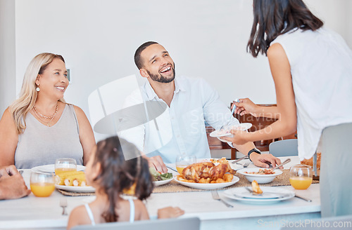 Image of Happy family, bonding and thanksgiving meal at dining table in house, home or restaurant for holiday celebration. Smile, happy or festive man, women and children with traditional healthy food serving