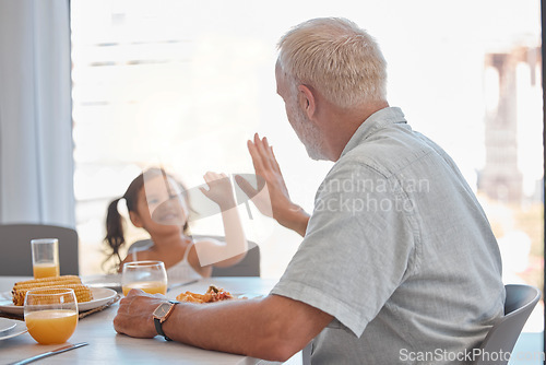 Image of High five, breakfast and family with a girl and grandfather sitting at a dining room table for eating food. Motivation, health and children with a senior man encouraging his grandchild to eat healthy