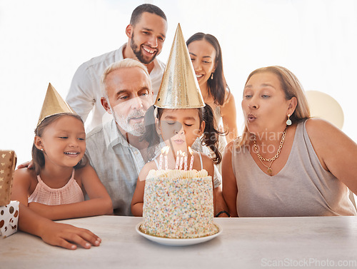 Image of Children birthday party, birthday cake or candles for blowing out with mother, father and senior grandparents in home. Fun, excited or happy kids and dessert food in celebration event in family house