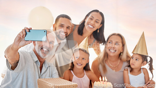 Image of Party, family and birthday phone selfie with grandparents, parents and young children celebrating. Interracial, happy and celebration with birthday cake photograph of grandpa, grandma and kids.