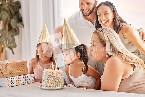 Image of Family, kids and birthday cake with a child and her big family celebrating with a party for fun event. Generations, mother and father with grandparents and grandkids celebrate with dessert or candles