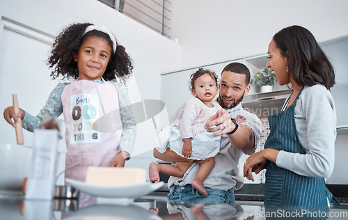 Image of Kitchen cooking, pointing and family of happy parents, baby and children learning to bake food, bonding and having fun. Black family love, child development and mother and father teaching kids baking