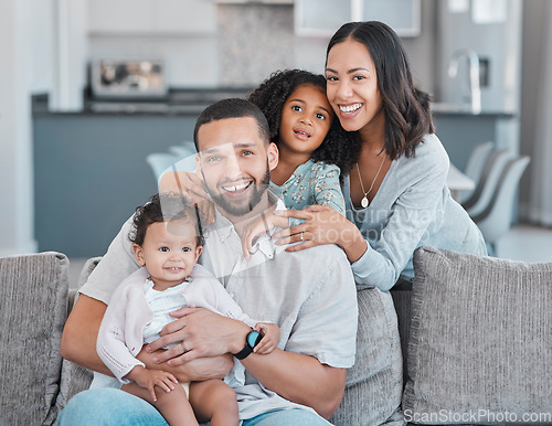 Image of Happy family, portrait and home with mother, father and children together in the living room at home for love, care and happiness. Smile of a black man, woman and kids in their Puerto rico house