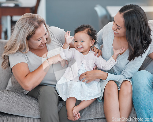 Image of Family home, love and baby, mother and grandmother with happiness on living room couch for love, care and fun while excited, happy and dancing. Generation of women on the sofa for support and pride