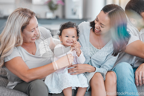 Image of Family, love and baby with a mother, grandmother and infant girl bonding on a sofa in the living room of a house. Mothers day, children and visit with a female toddler, woman and daughter at home