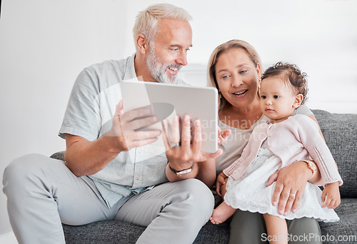 Image of Grandparents, baby girl and tablet learning on living room sofa for online games, watching cartoons and relax at home. Happy family, grandmother and grandpa play with child on digital educational app