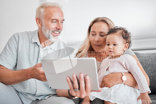 Image of Family, tablet and baby with grandparents on sofa in home on social media, streaming movie or educational app. Relax, love and grandpa, grandma and infant or child with touchscreen tech for cartoons.