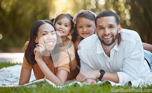 Image of Family, portait and garden with a man and woman bonding with their little girl kids in summer. Nature, park and mother, father and daughter, sister and siblings relaxing on the grass for love bond