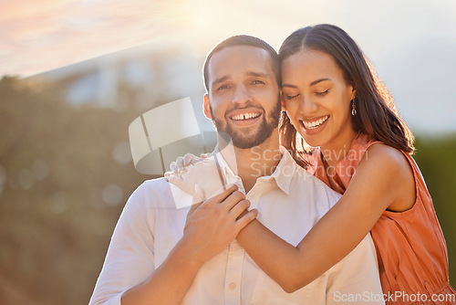 Image of Love, sunshine and portrait of couple in park enjoying summer holiday, vacation and weekend. Bonding, affection and happy young man and woman hugging, embrace and smiling together on romantic date