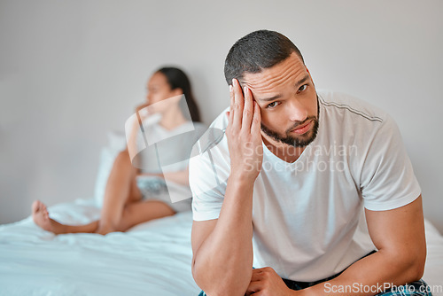 Image of Couple, divorce and stress in home bedroom, fighting or argument. Portrait, anxiety and unhappy man and woman, sad and depressed after infidelity, toxic relationship or failed marriage in house.