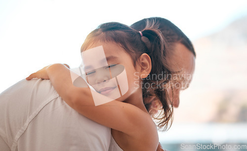 Image of Father, girl or bonding hug in support, love or security in house, family home or adoption center. Smile, happy child or kid embracing man, dad or parent in Indonesian children foster centre in trust