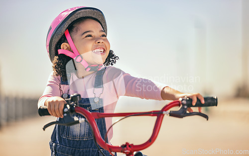 Image of Thinking, eco friendly and girl cycling on a bike, learning and training in city with a smile. Playing, exercise and child on a bicycle for carbon footprint, sustainability and happy in the street