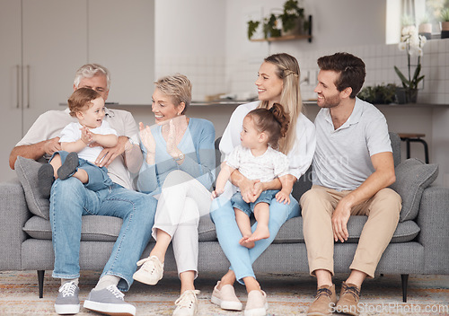 Image of Big family, love and relax on sofa in home living room, bonding and enjoying quality time together. Support, care and grandma and grandpa playing with baby and having fun with mother, father and girl