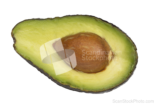 Image of Avocado fruit cut in half with seed