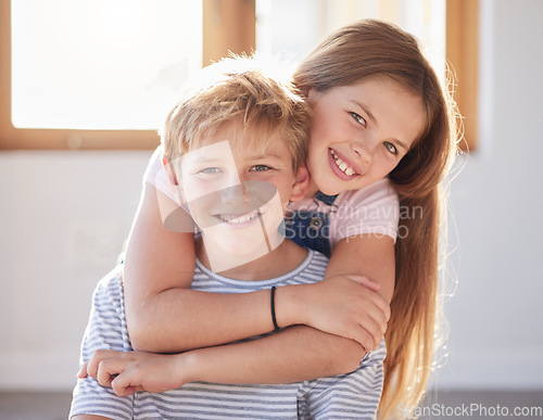 Image of Family, hug and portrait of girl an boy in a living room, bonding and happy while enjoying quality time together. Face, happy family and sibling brother and sister embrace, playful and relax at home