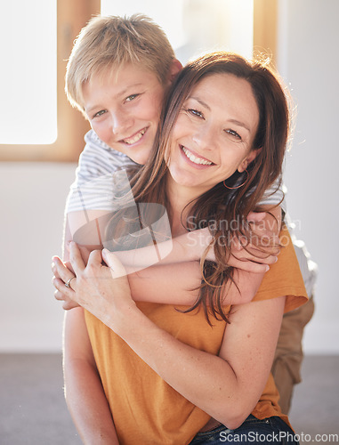 Image of Mother, hug and kid in a family home together with happiness, bonding and parent care. Portrait of a mom and child in a house with love and happy child care smiling and hugging in a living room