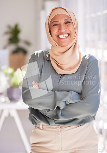 Image of Success, leadership and portrait of Muslim woman in office with crossed arms, smile and confidence. Empowerment, professional and happy female worker standing in workspace for marketing startup