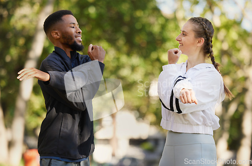 Image of Interracial, couple and stretching for wellness, training and exercise for workout and bonding in park. Healthy, man and woman outdoor for fitness, practice and together to relax, health and speaking