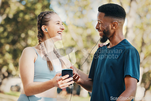 Image of Music, fitness and running with a diversity couple outdoor in park for exercise or training together. Fitness, phone and workout with a sports man and woman outside listening to runner motivation