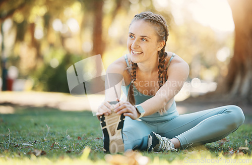 Image of Fitness, woman and stretching by woman in a park for yoga, wellness and exercise, zen and happy in nature. Exercise, girl and leg stretch before mediation in a forest for cardio, workout and pilates