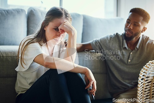 Image of Stress, divorce and couple in living room after a fight, argument or conflict in the marriage at home. Sad, depression or woman with a worried and tired partner cheating thinking of breakup in house