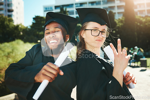 Image of Graduation, students and happy for success, achievement or silly together outdoor. Portrait, man and woman smile, for completed degree and in gown for education, certificate and diploma at university