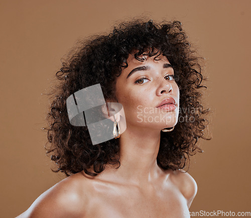 Image of Black woman, beauty and skincare face portrait for natural afro, facial or hair care cosmetics. Healthy, beautiful and assertive model with curly hair shine and texture in brown studio background.