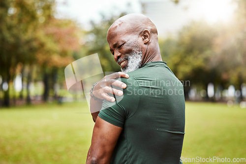 Image of Senior black man with shoulder pain, fitness injury and exercise in the park with muscle ache or inflammation outdoor. Health, accident during workout and hurt, elderly person with pain from sport.