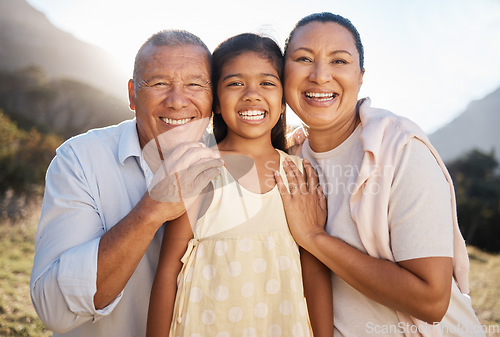 Image of Happy, portrait and grandparents with girl in nature for family, relax or support. Embrace, bonding and summer with old man and woman smile with grandchild for affection, hug or youth in countryside