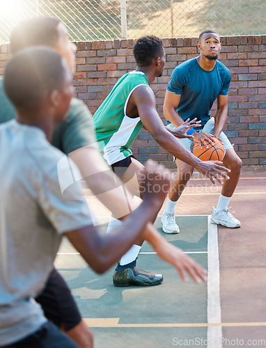 Image of Basketball, game and team sports for match point, score or ready for a shot at the basketball court. Basketball players in sport fitness, exercise or workout at the court together in the outdoors