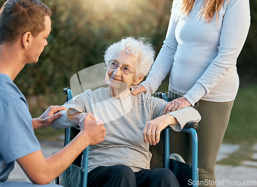 Image of Support, caregiver and senior woman in wheelchair with help, medical healthcare and disability assistance from male nurse. Volunteer worker, adult daughter and disabled patient on nursing home estate