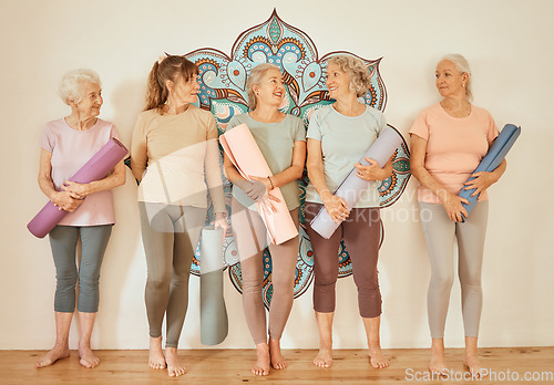 Image of Yoga, fitness and pilates with a senior woman group in an exercise class for a workout or training for health. Zen, wellness and balance with a female retirement team in a studio for inner peace