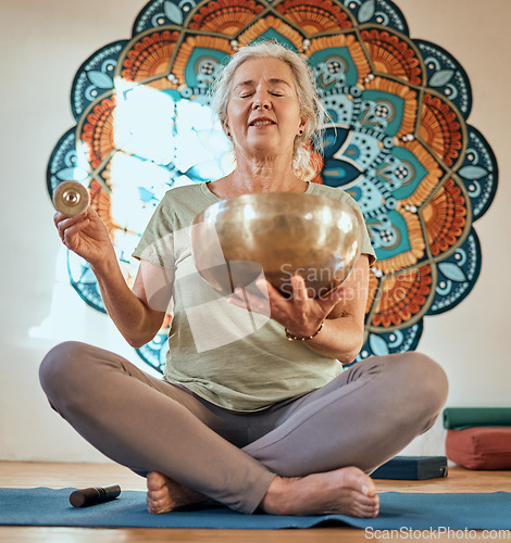 Image of Senior woman, yoga and meditation in fitness studio for body health and wellness motivation with gold bowl and mandala. Spiritual, energy and balance with mindfulness and zen, healthy and peace.