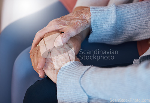 Image of Holding hands, love and support in trust for elderly care, retirement or hope and respect at old age home. Senior hands touch in care, praying or comfort for help, reliable or community healthcare