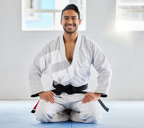 Image of Karate, fitness and athlete, man with black belt and martial arts portrait, training and discipline with exercise. Taekwondo, combat sport and active with power and strong, sports motivation in dojo.