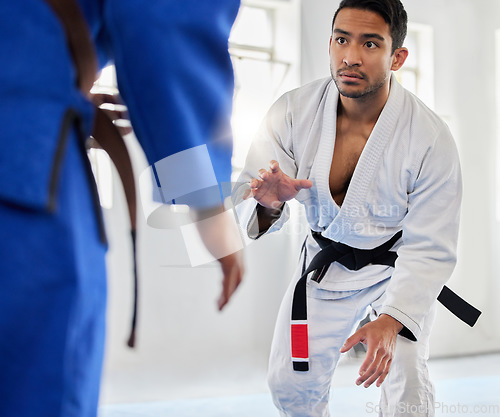 Image of Karate, sports and sensei with man and woman fighter ready for combat sport in a gym or dojo. Fitness, workout and exercise with a male and female fight athlete training together in a health club