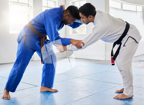 Image of Karate, martial arts and men fighting in dojo for sports and health with discipline and balance in battle. Fitness, workout and exercise, mental wellness in fight studio or gym with warrior mindset.