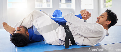 Image of Karate, martial arts and fitness class with men on ground to fight, train and coach student for combat sports competition. Self defence, power and energy at a fighting club for exercise and workout