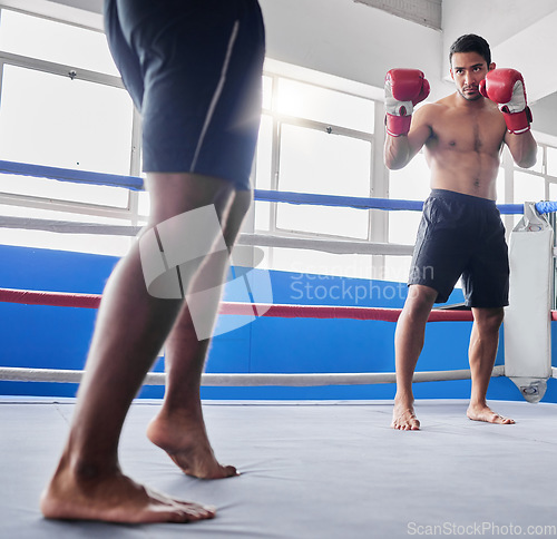 Image of Boxing, sports and fight with a man athlete in the ring with a rival for competition in a sport club. Gym, fitness and exercise with a male fighter and coach training in a health facility together