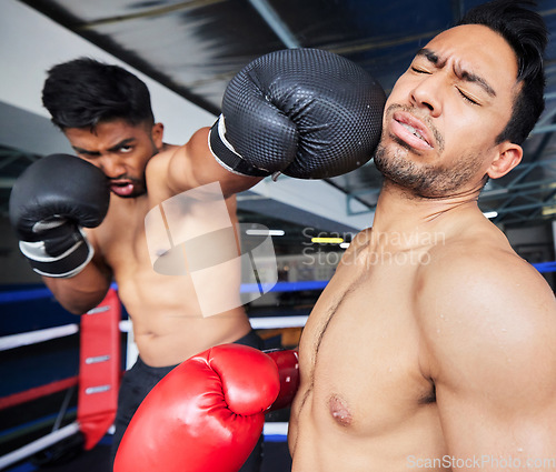 Image of Fitness, exercise and boxing match, punch or knock out in ring. Healthcare, sports or boxers, athletes or fighters fighting in competition, training or workout for wellness in gym or fitness center.