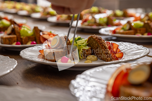 Image of Chef are arranging small pieces of food