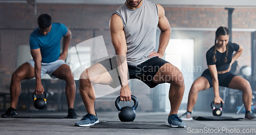 Image of Fitness, weightlifting and kettlebell class for arm workout, exercise or training together at the gym. Active people in sports exercising with kettle weights for healthy cardio endurance or wellness